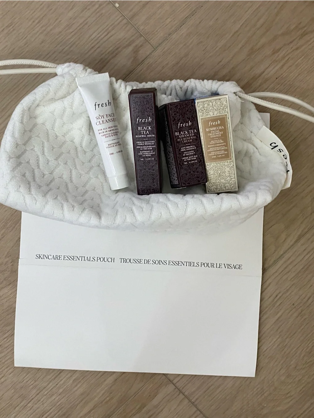 fresh White Drawstring Pouch with Assorted Lip & Body Treatments